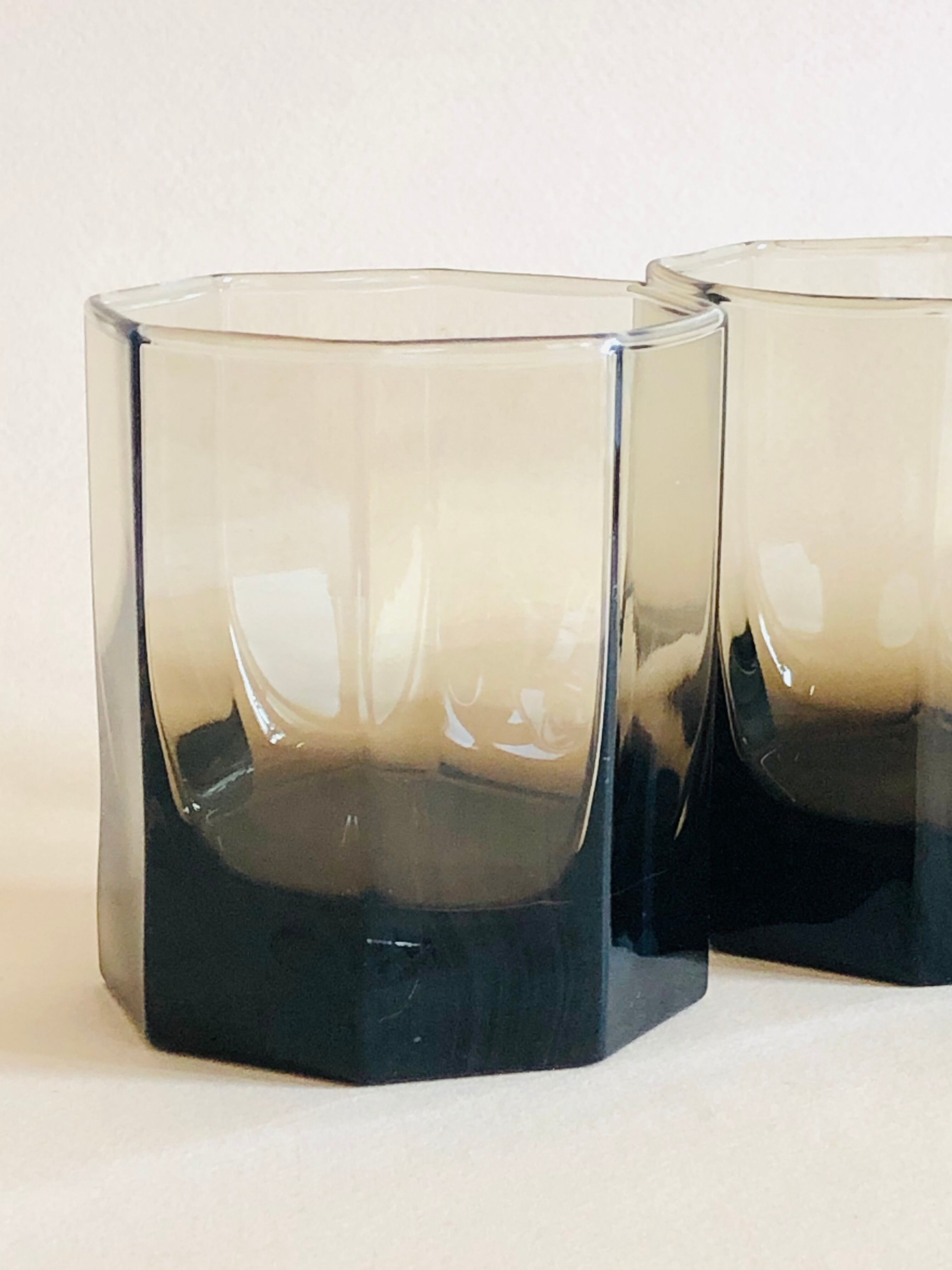 Pair of octagonal black glass whiskey glasses