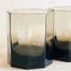 Pair of octagonal black glass whiskey glasses