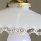 Old lampshade in white opaline glass with a wavy edge.