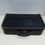 Small suitcase in old navy blue cardboard