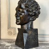 Head of a faun smiling, bronze after the antique, 19th century.