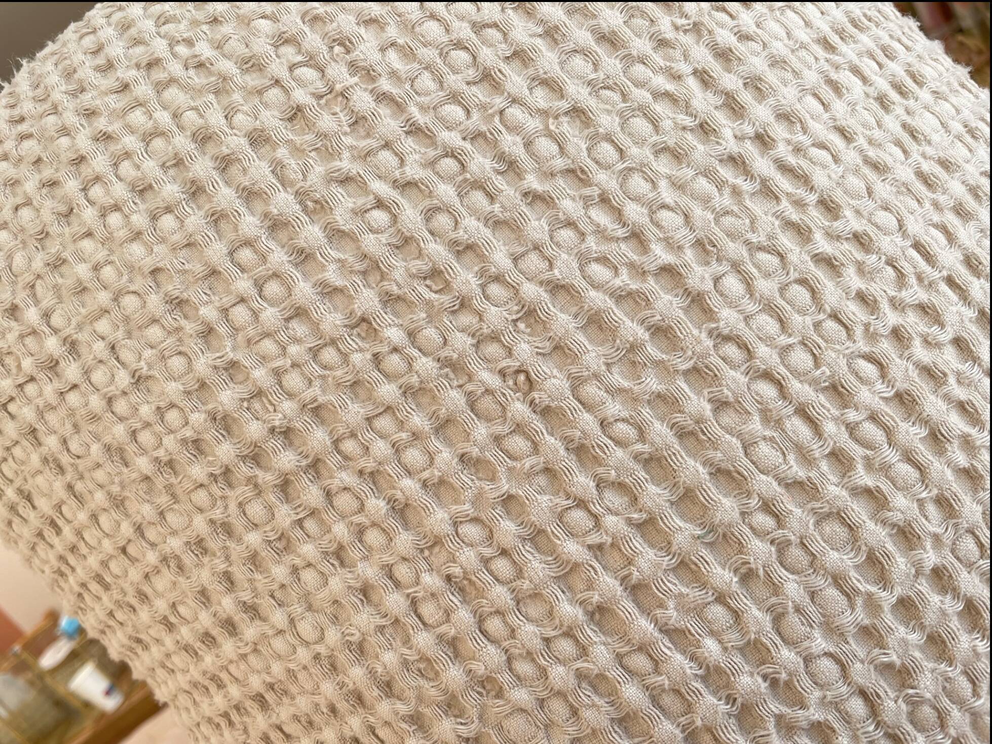 Light beige embossed cushion