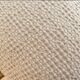 Light beige embossed cushion