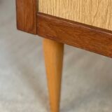 Vintage 1960s chest of drawers with covered handles.