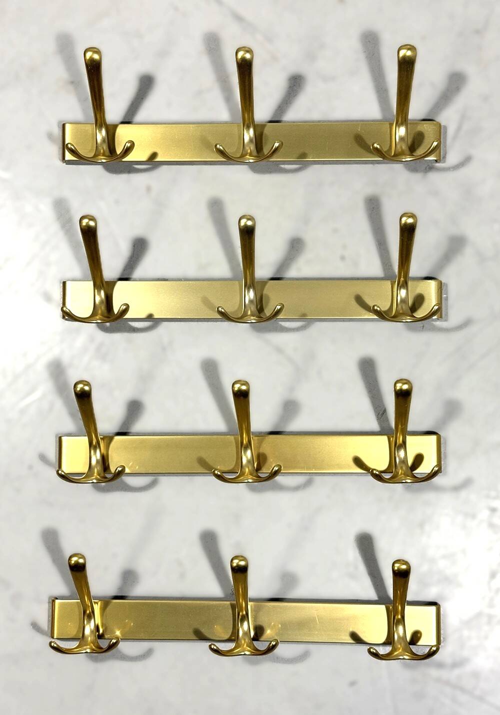 Gold coloured aluminium wall coat racks 1960’s