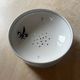 Fruit strainer in earthenware, Pornic, lily flower design.