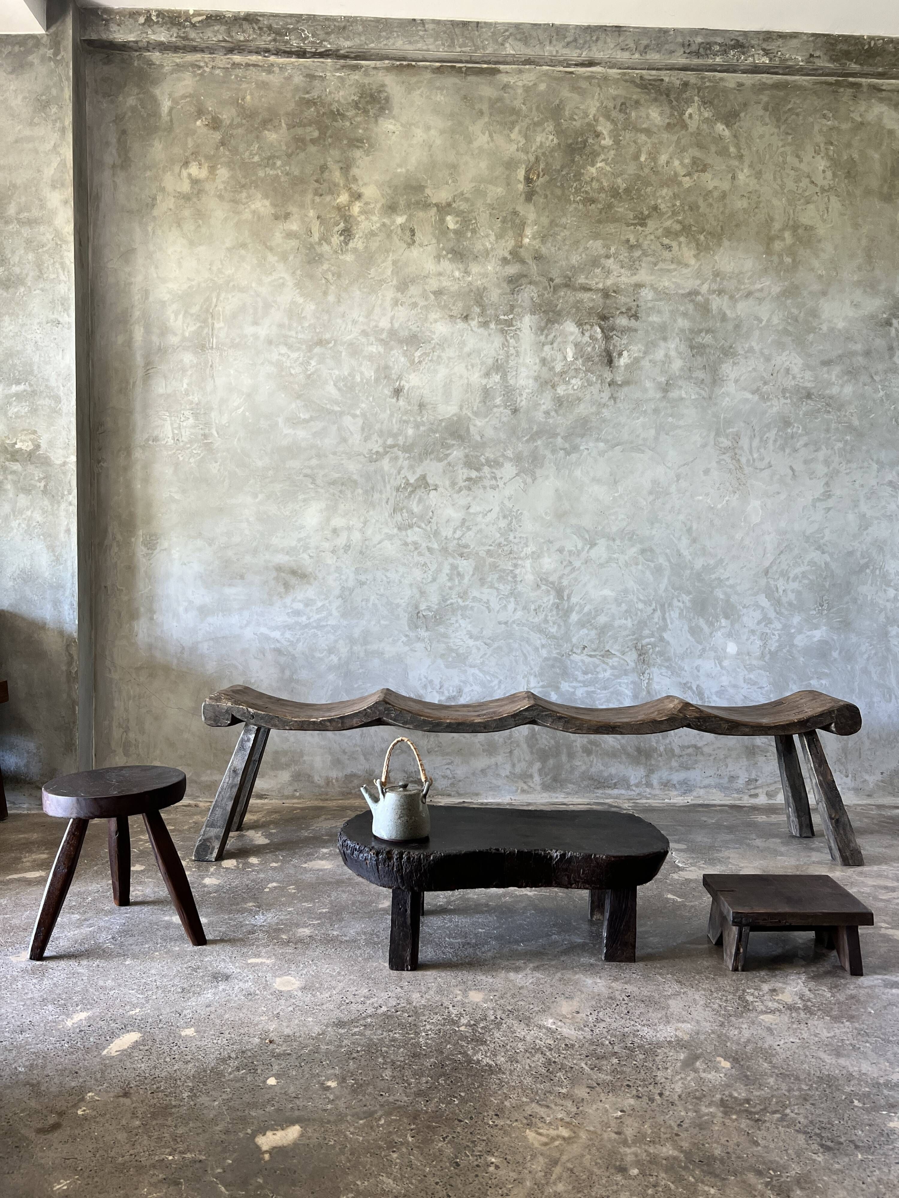 Small old Asian wooden coffee table in Japanese style, kidney-shaped top