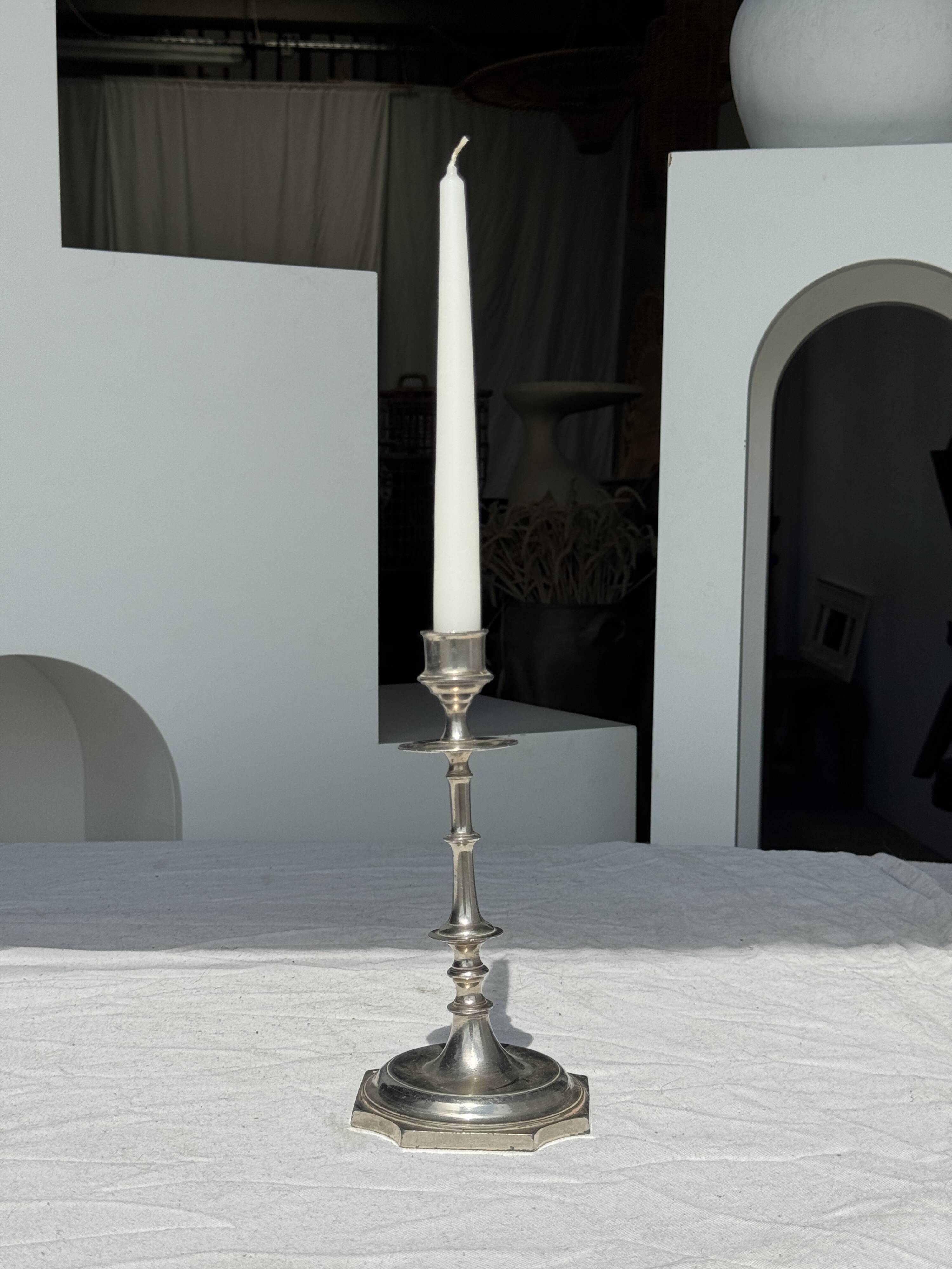 A large silver candlestick holder H23