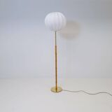 Mid-century floor lamp in brass and oak by Falkenbergs Belysning, Sweden, 1960s.