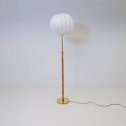 Mid-century floor lamp in brass and oak by Falkenbergs Belysning, Sweden, 1960s.