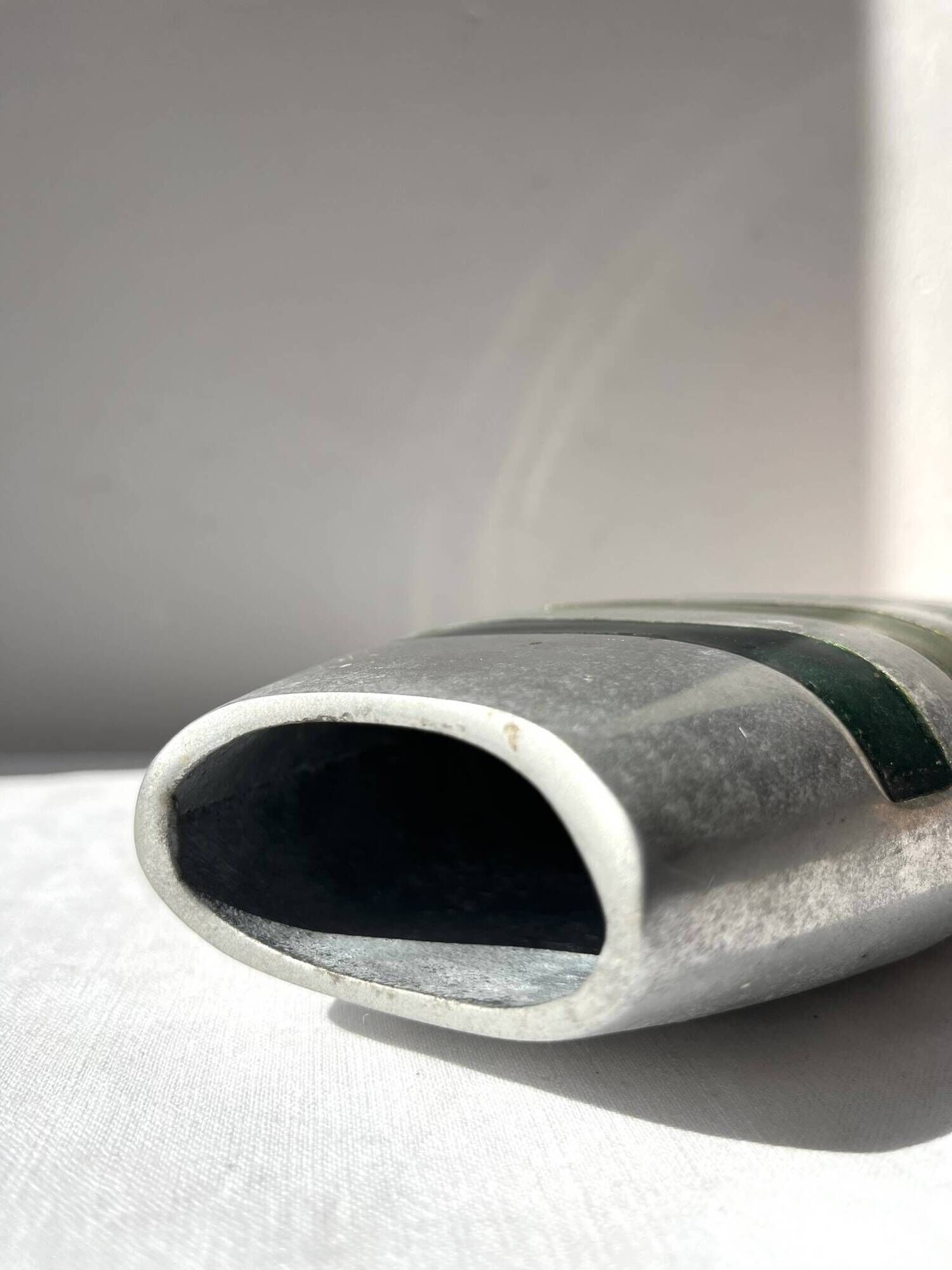 Vintage brushed aluminium vase with green stripes.