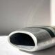 Vintage brushed aluminium vase with green stripes.