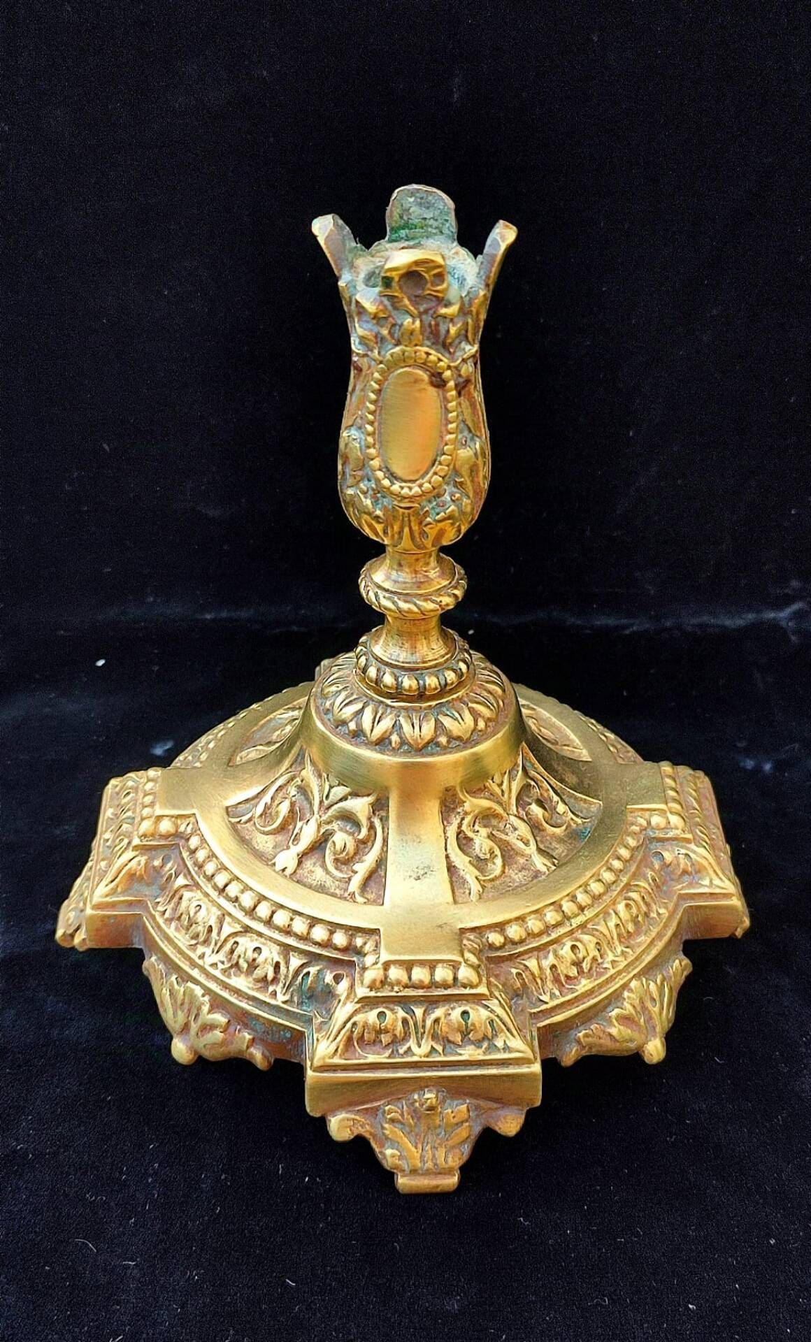 Pair of antique carved bronze candlesticks.