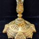 Pair of antique carved bronze candlesticks.