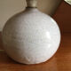 Ceramic table lamp and rafia