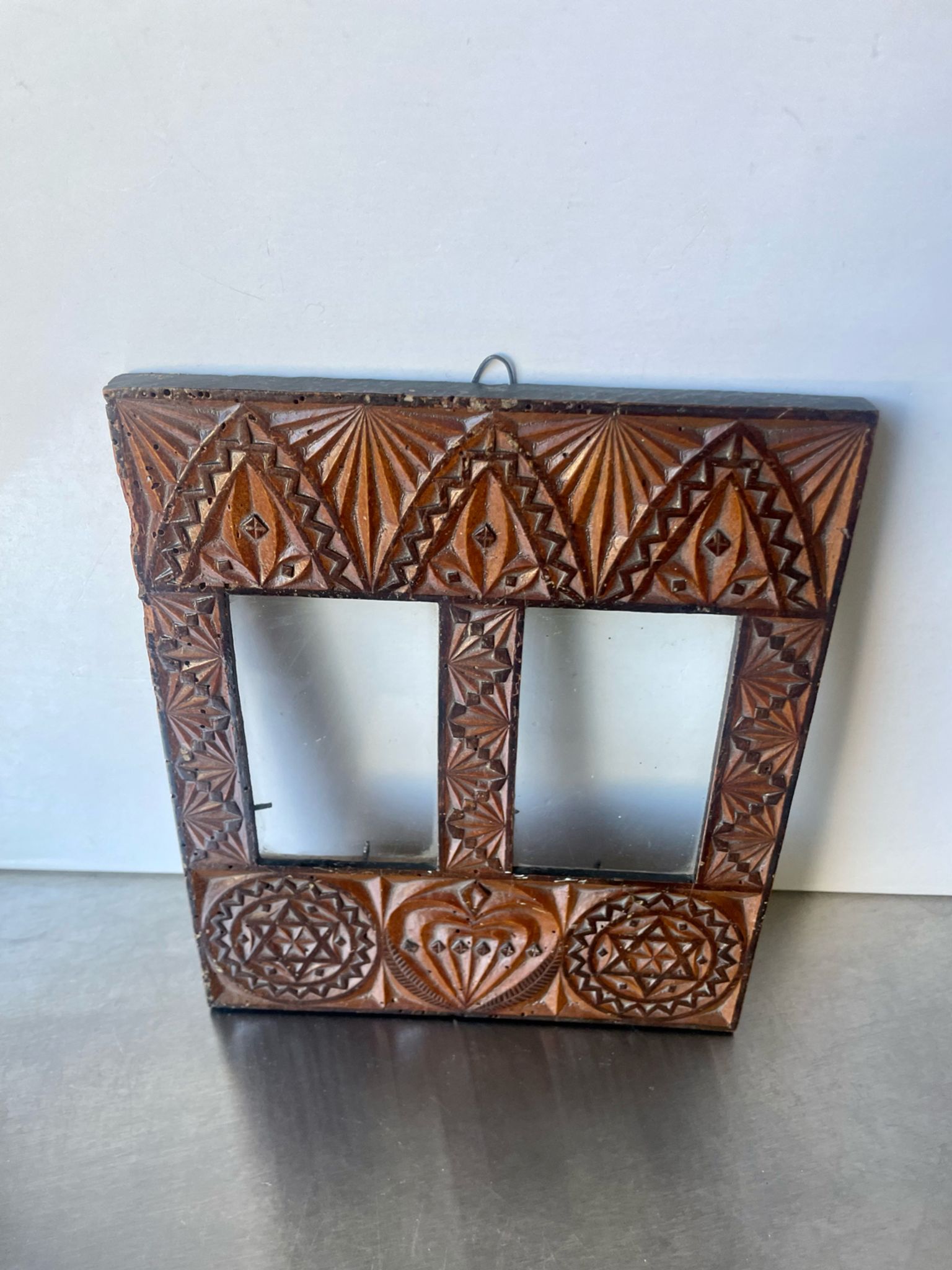 Double frame intricately carved wood