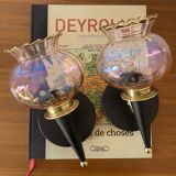 Pair of torch wall lights with iridescent pink glass shades and gold trim.