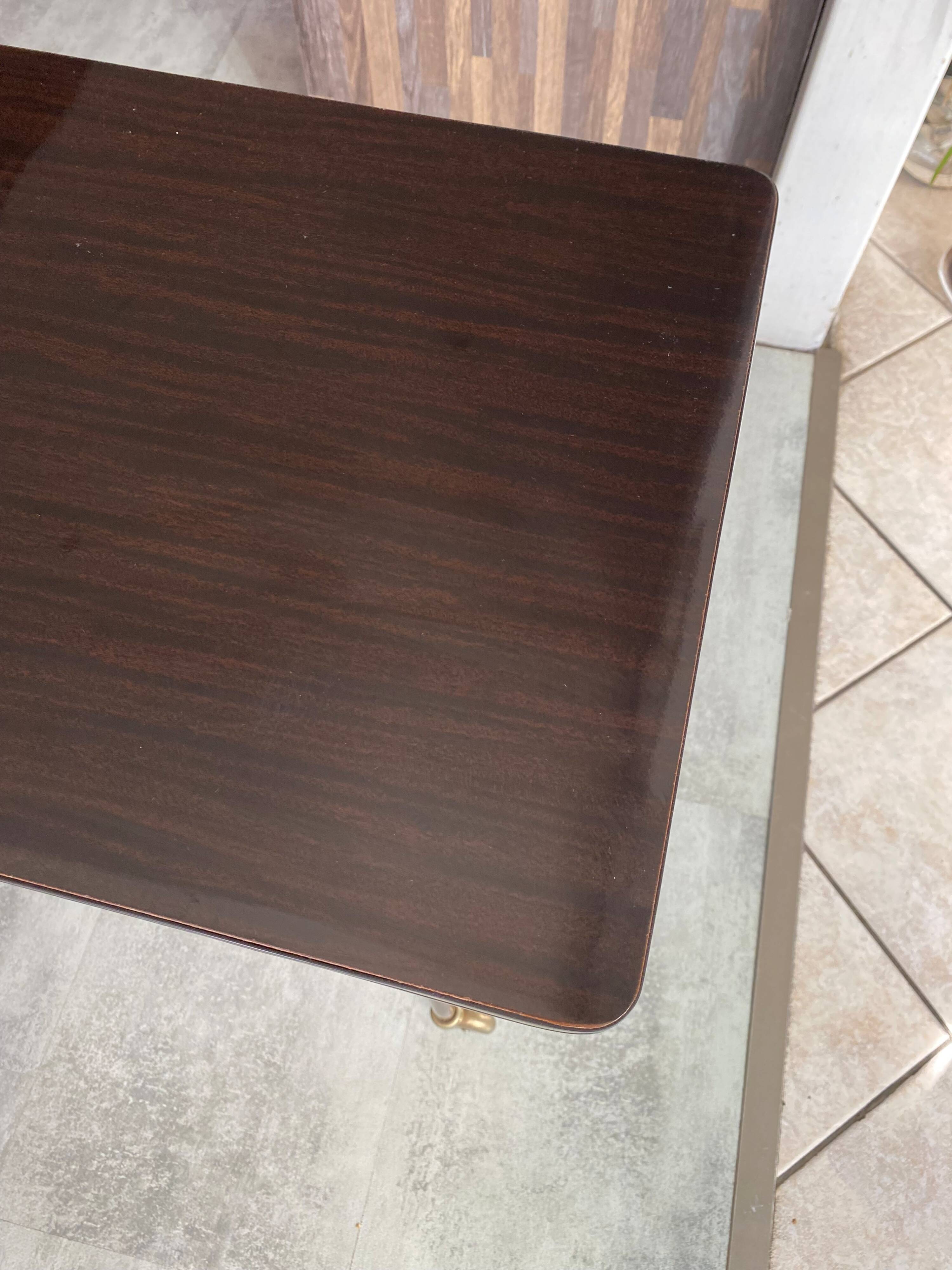 TV stand on casters, 2 brown Formica shelves, 1960s