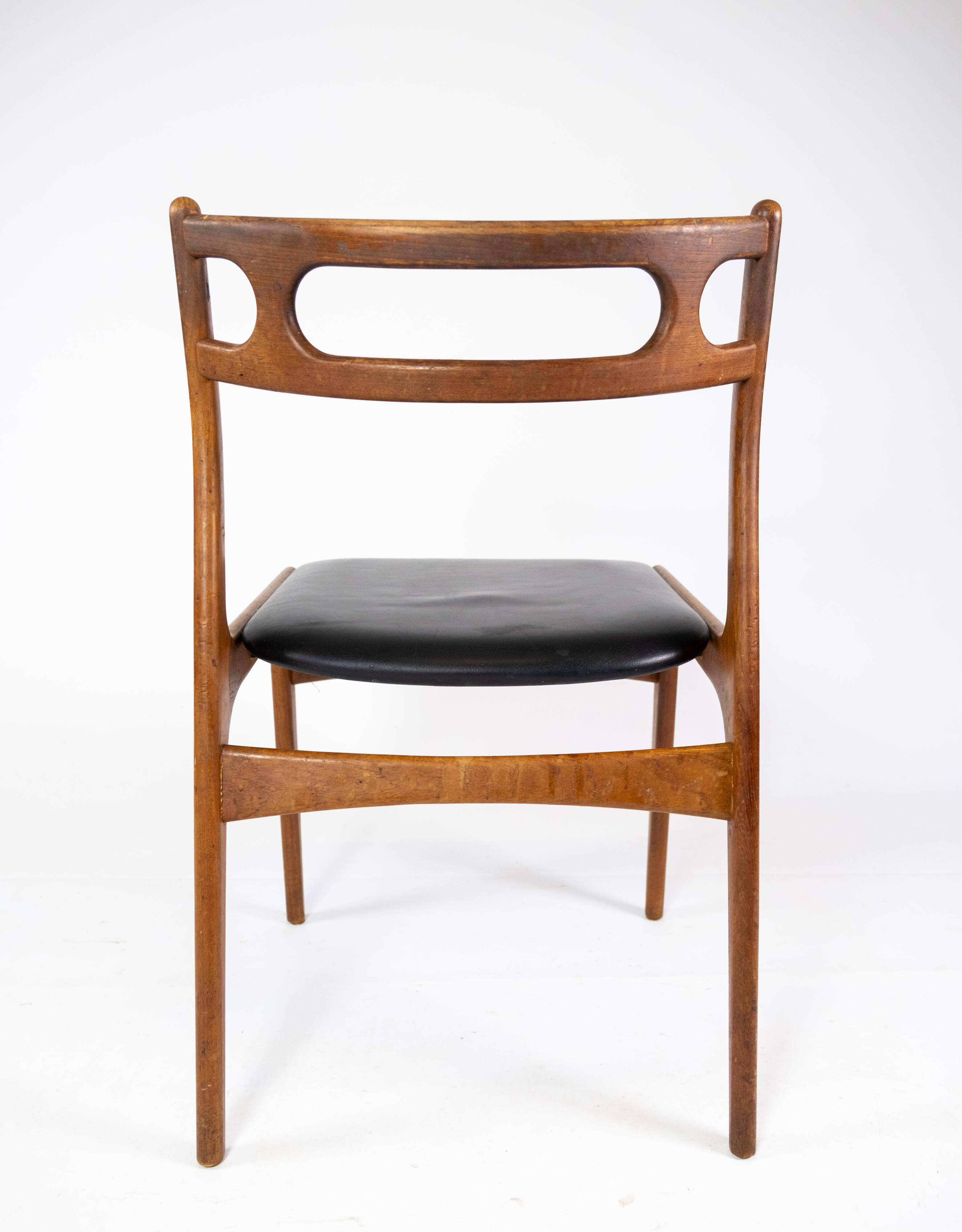 A set of four dining room chairs of teak of danish design, 1960s