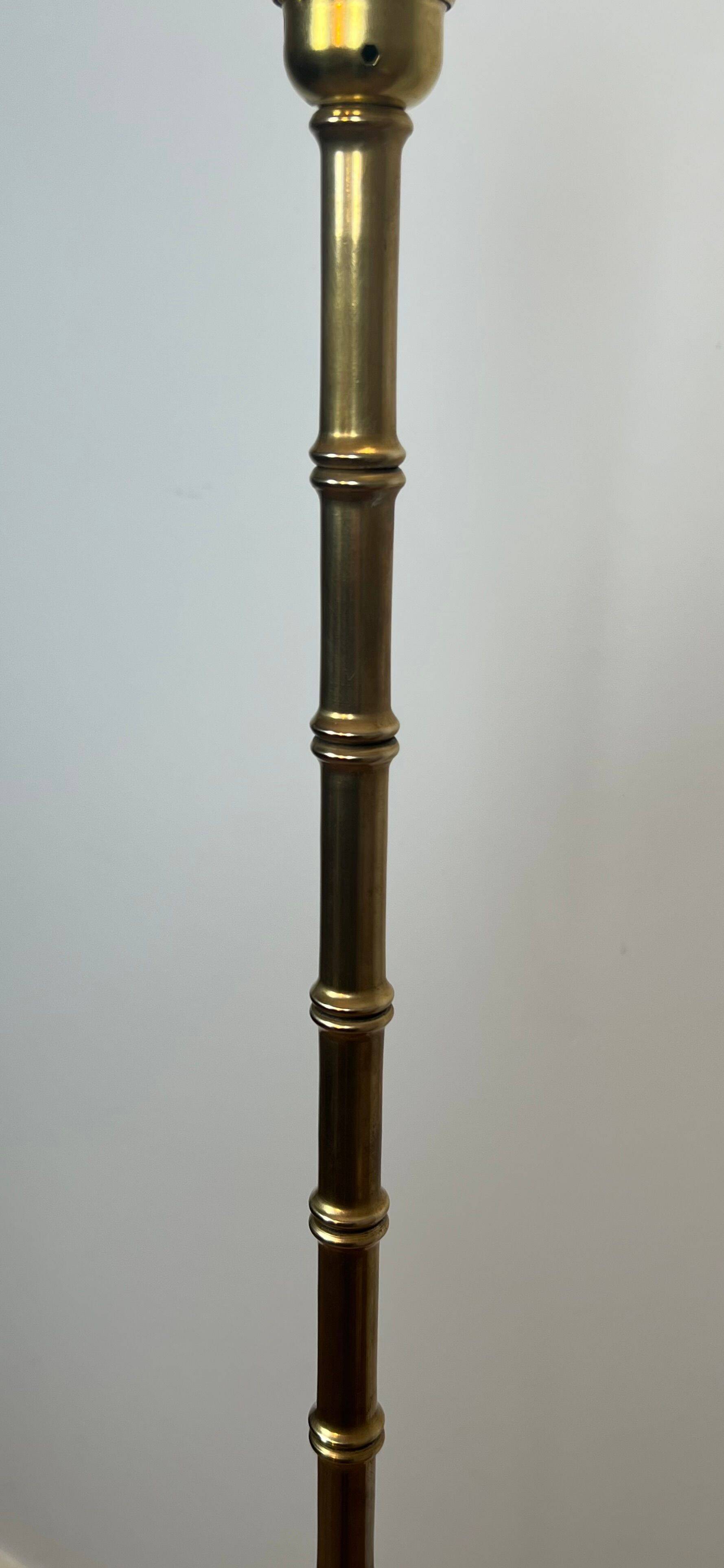 Pair of parquet floor lamps in faux-bamboo style in bronze and brass by Jacques Adnet.