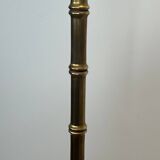Pair of parquet floor lamps in faux-bamboo style in bronze and brass by Jacques Adnet.