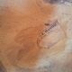 Curved wooden armchair