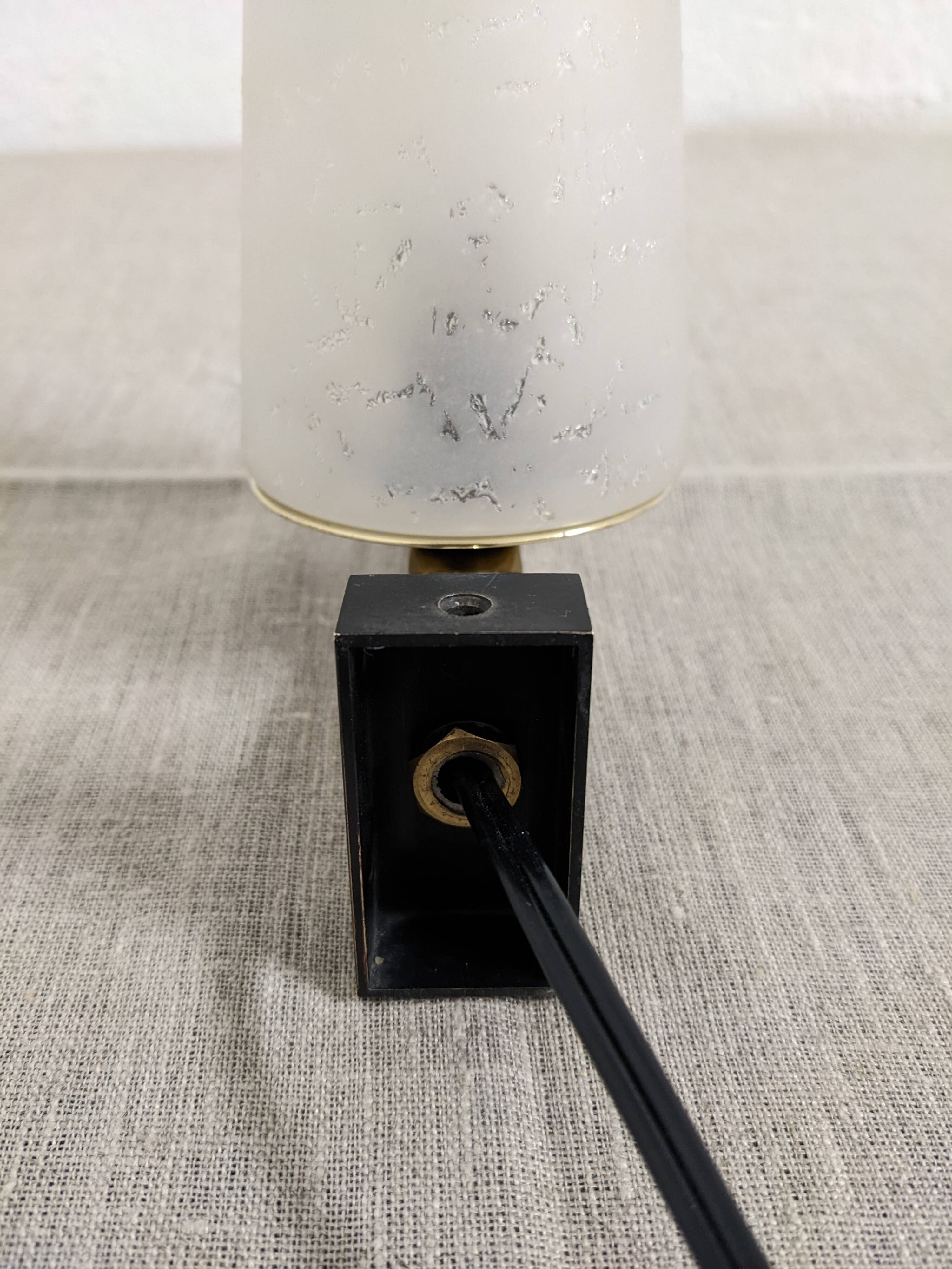 Modernist wall light in glass and brass by Maison Arlus, France circa 1950.