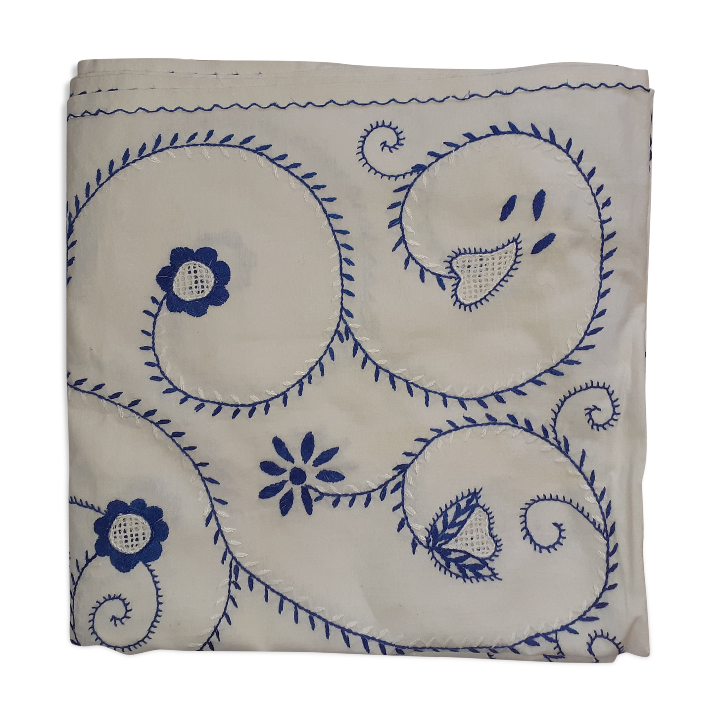 Old white background and blue embroidery.
