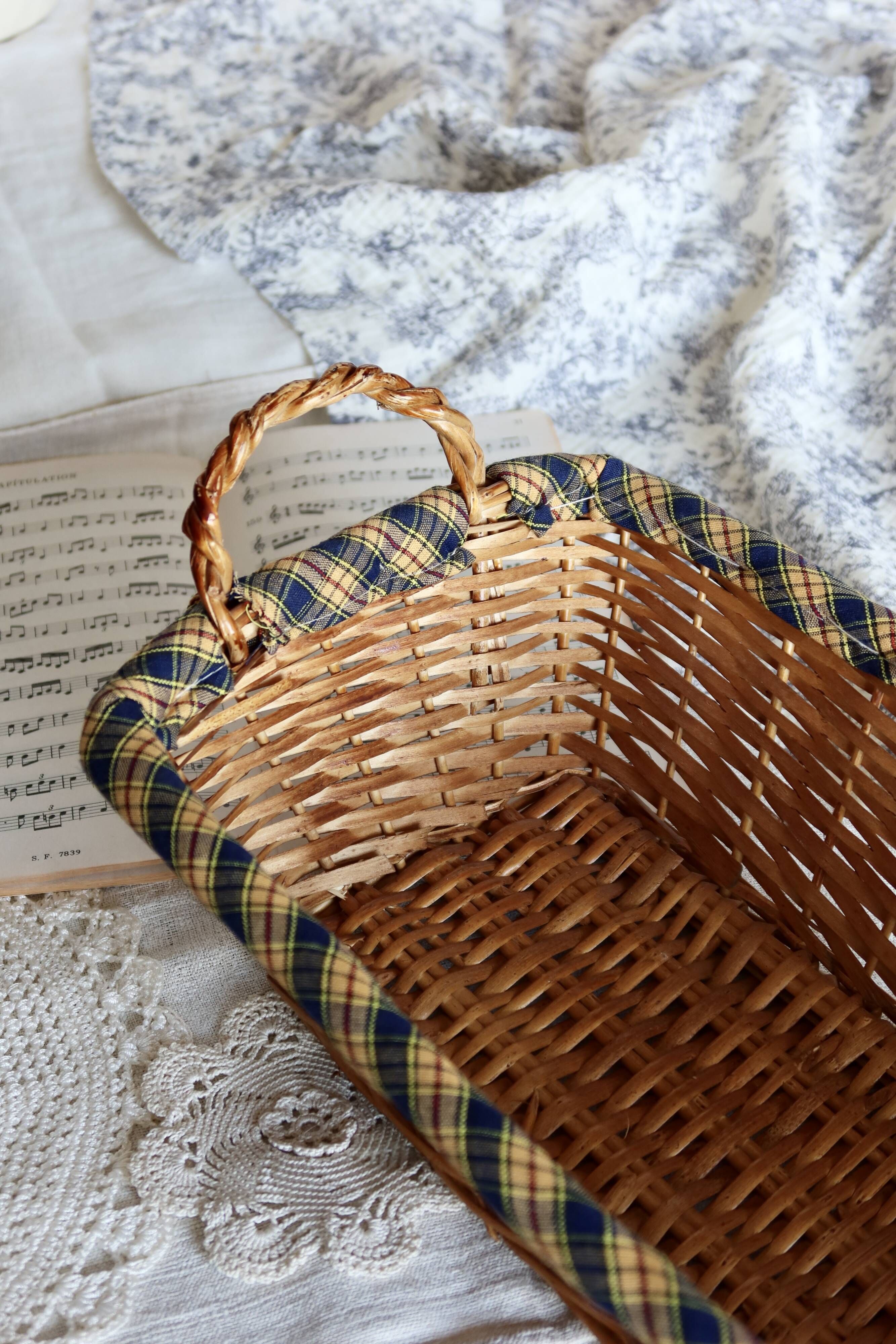 Vintage wicker basket with blue and yellow checkered lining