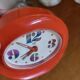 Vintage mechanical alarm clock in orange plastic Uti West Germany