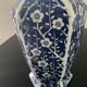 Vintage porcelain vase with white and blue decor