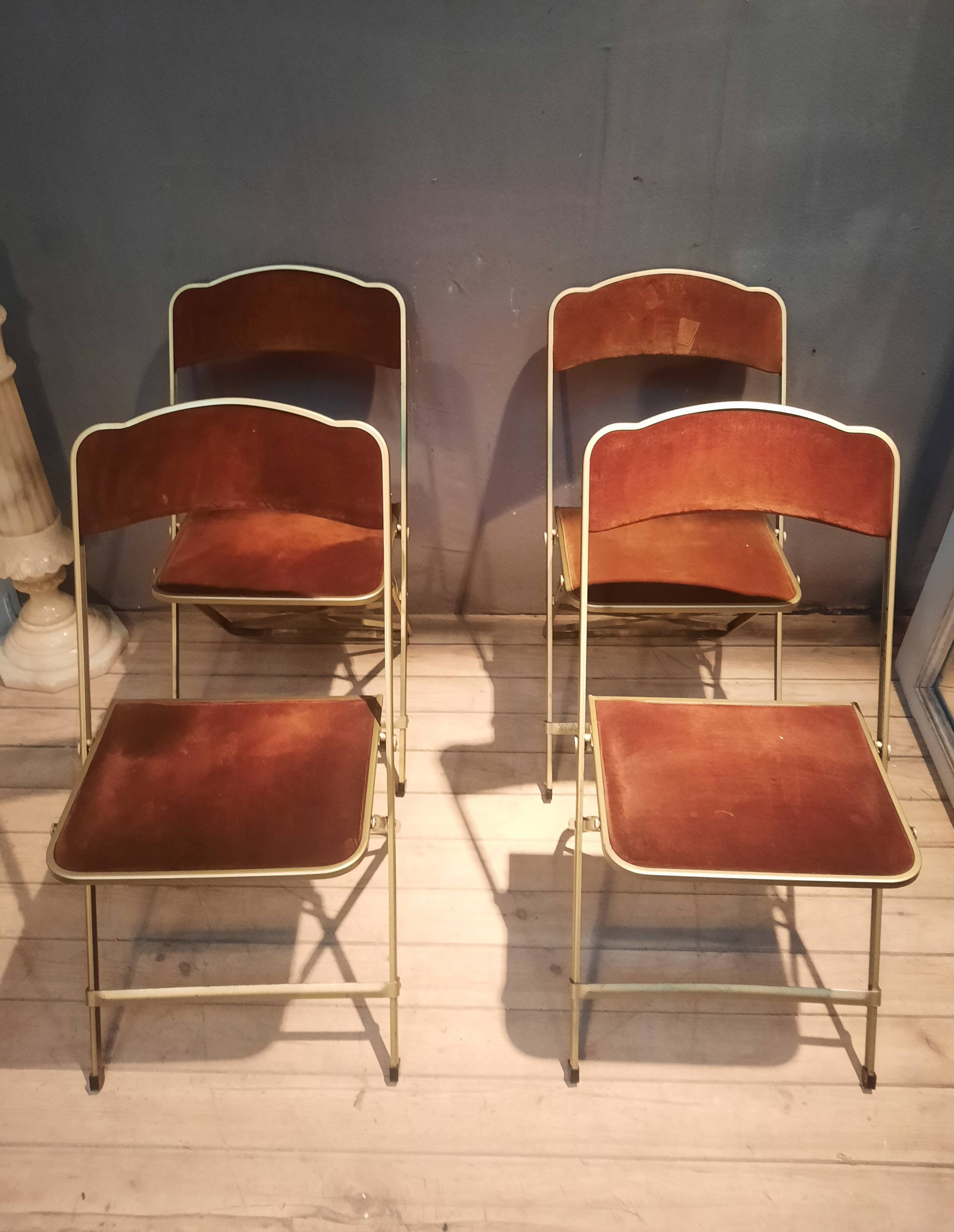 Set of four folding metal and velvet chairs