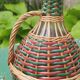 Glass and rattan carafe