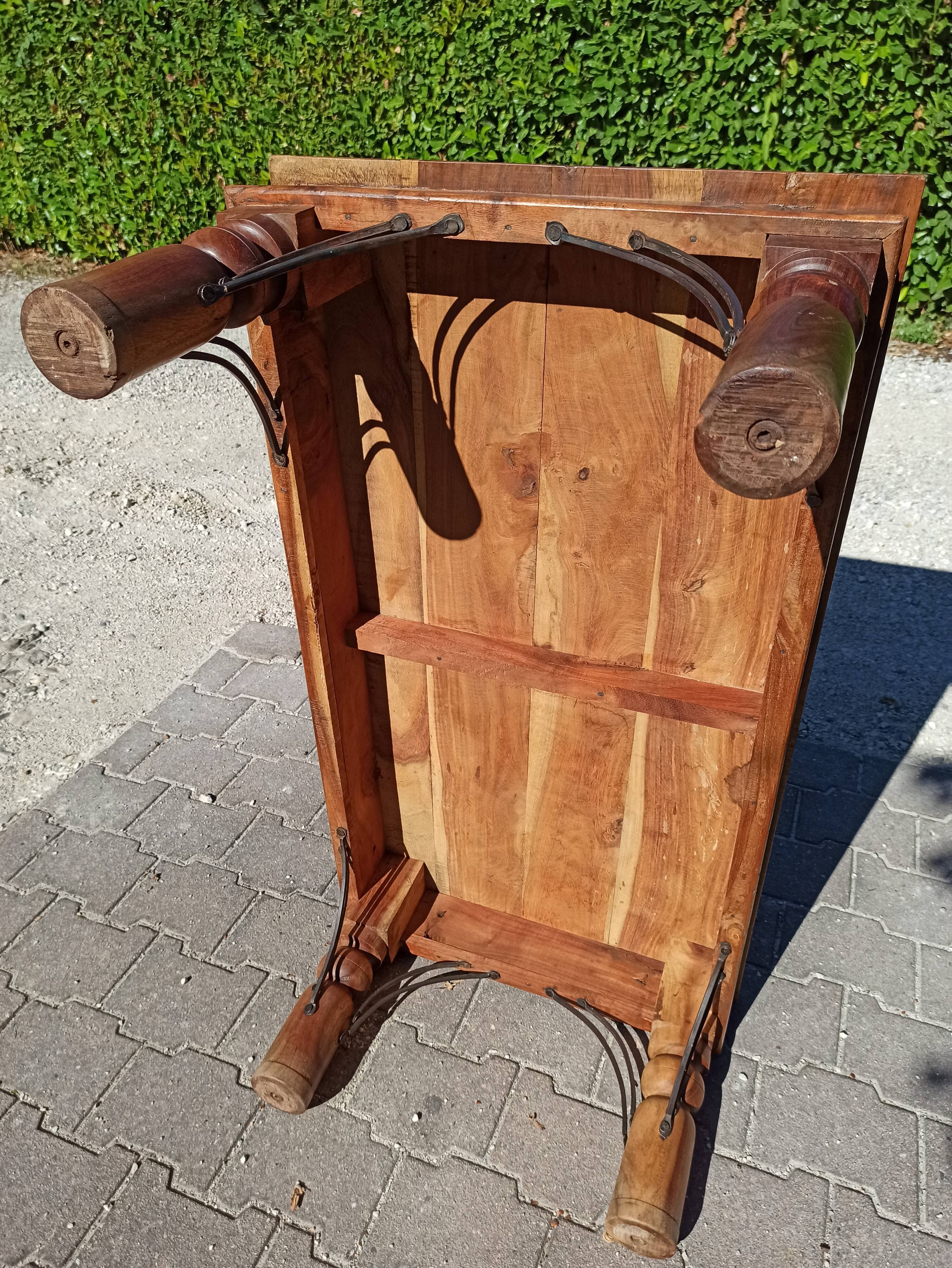Medieval-inspired red oak coffee table with ironwork