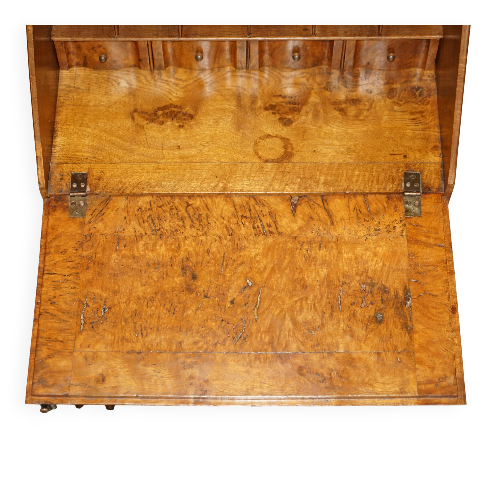 Writing desk in pollard oak from around 1800 with claw and ball carved legs.