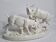 Saxon porcelain group, two fighting goats, signed Röhle, 1900
