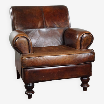 Spacious sheepskin armchair with a relaxed deep seat