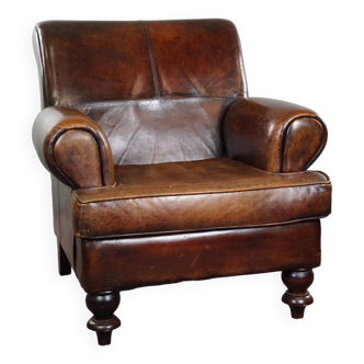 Spacious sheepskin armchair with a relaxed deep seat