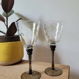 Two smoked black stem wine glasses