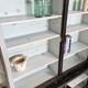 Display cabinet in patinated wood