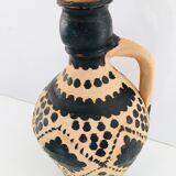 Raw and black terracotta jug