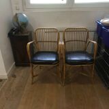 Pair of vintage rattan and leatherette armchairs
