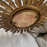 Sun mirror in old wood