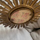 Sun mirror in old wood
