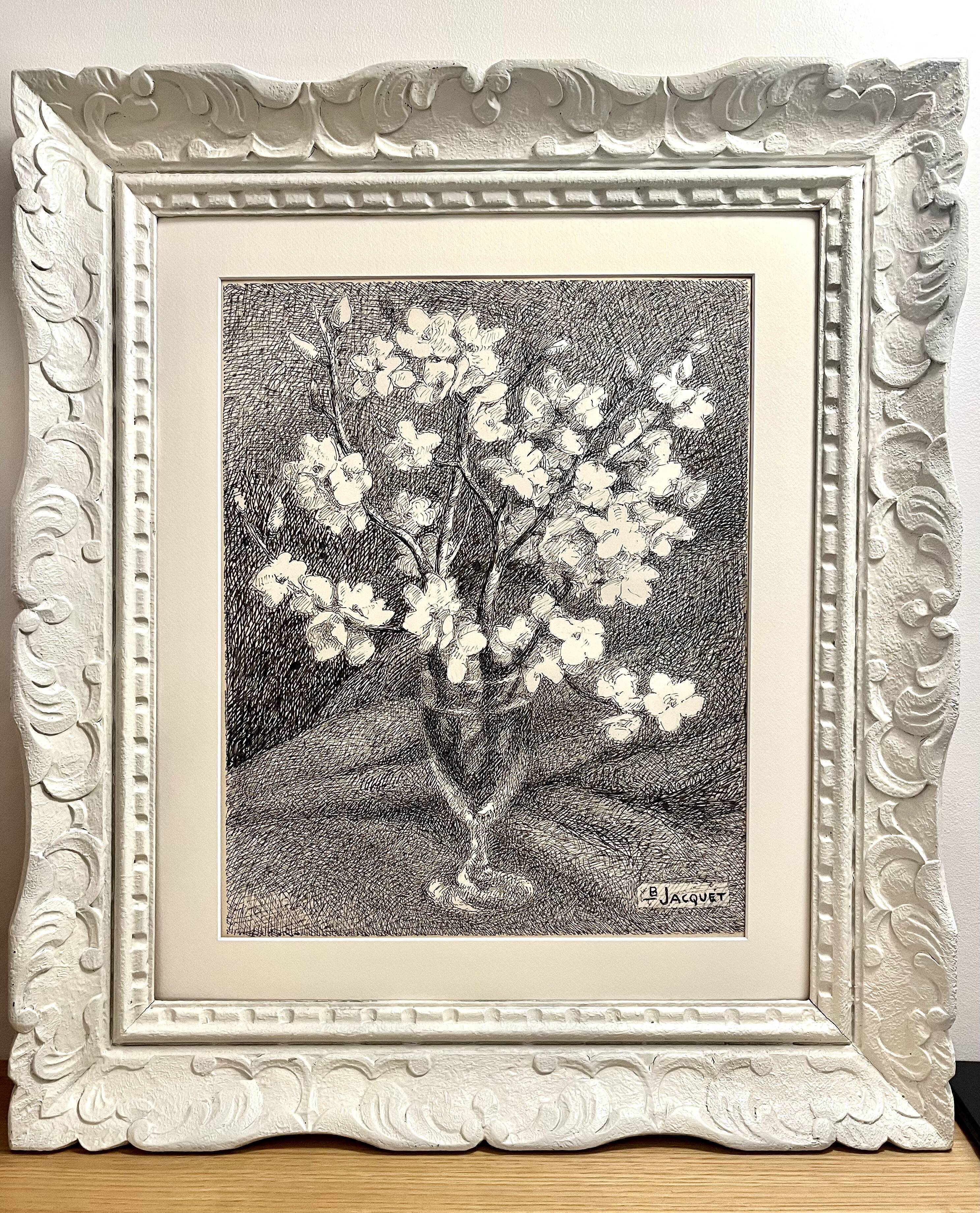 Almond branches in bloom in a glass of water