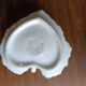 Night or hand-held porcelain candle holder in the shape of a leaf.