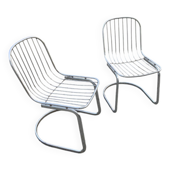 Two Gastone Rinaldi style chrome metal chairs.