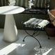 pair of wrought iron stools with cushions