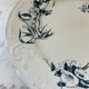 Flat earthenware plate with floral motifs
