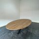 Oval table in solid oak refined edges with central foot in black metal